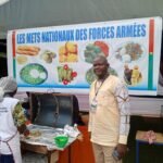 Militaires préparant des repas dans les cuisines roulantes au SIAO pour les JEPPC 2026.